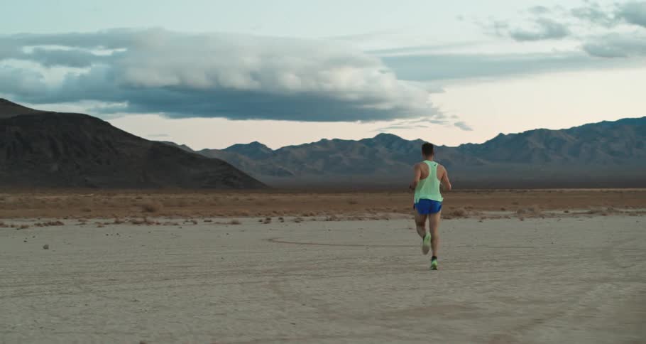 A man is running in the desert