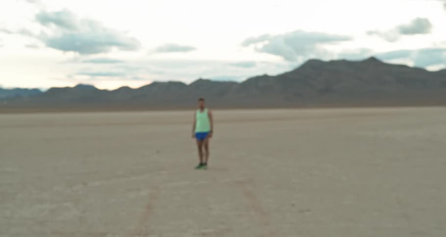 A man is standing in the desert