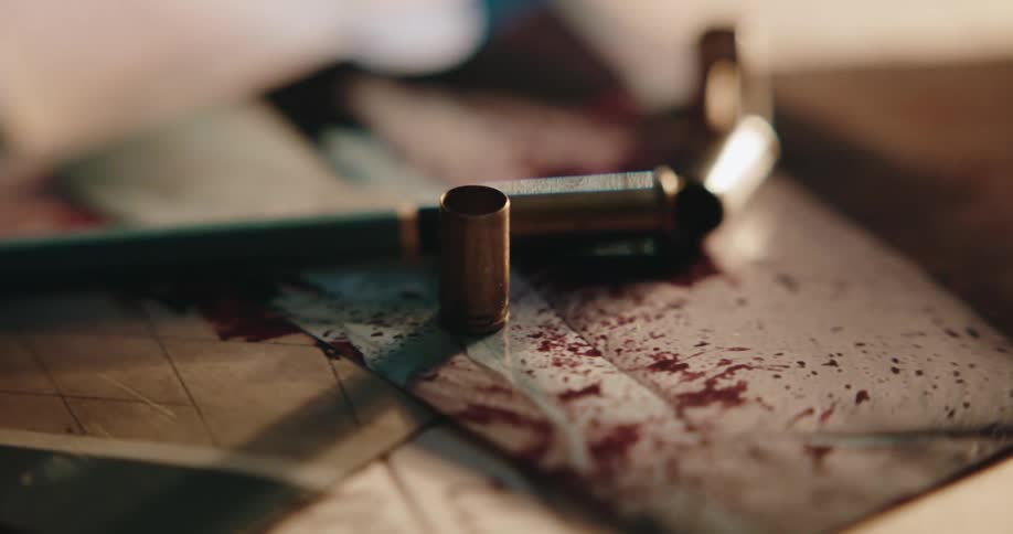Shell casings and papers with blood