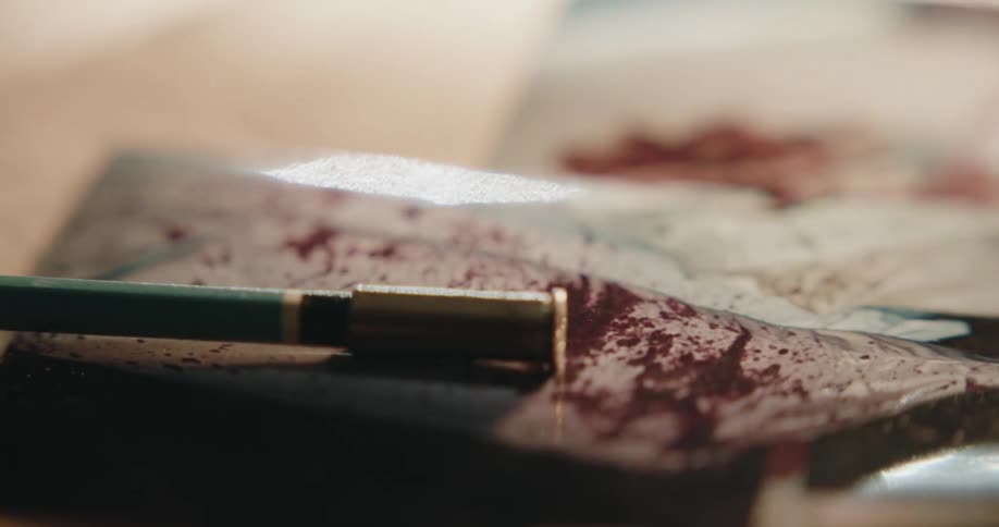 Shell casing and pen and papers with blood