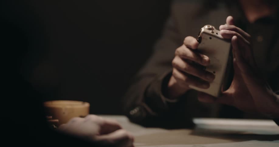 A view of a man playing a tape recording