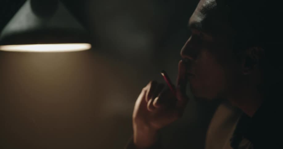 A view of a man interrogating someone