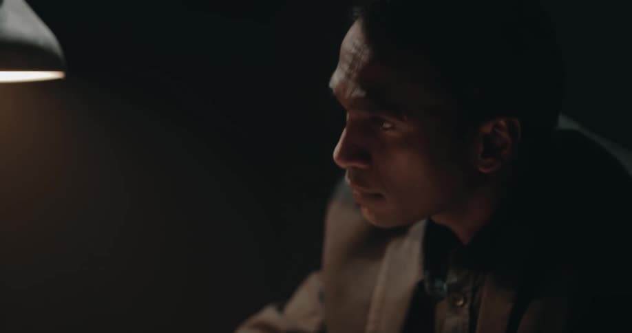 The officer is interrogating a man