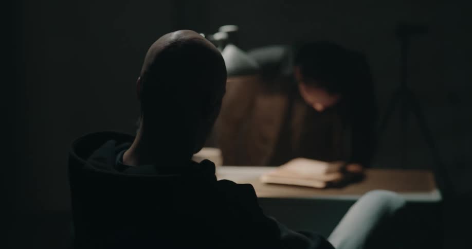 A man getting interrogated by the police