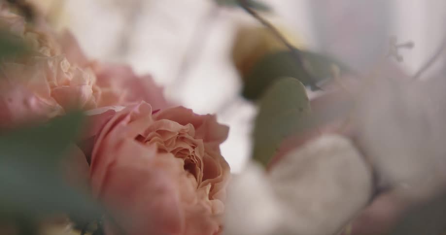 A person is arranging a flower bouquet