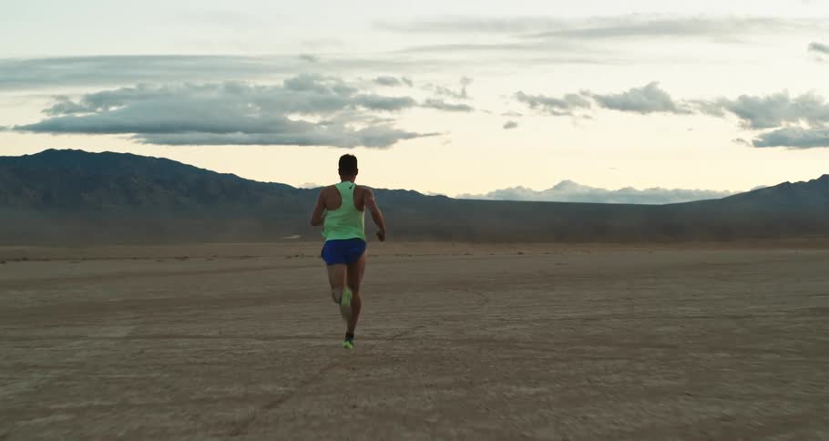 Man is jogging outside in the desert