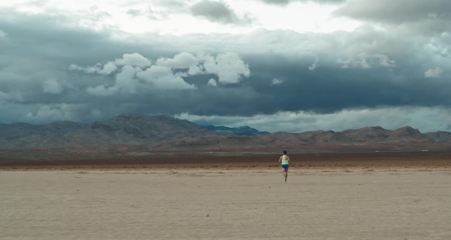 Man is jogging fast in the desert