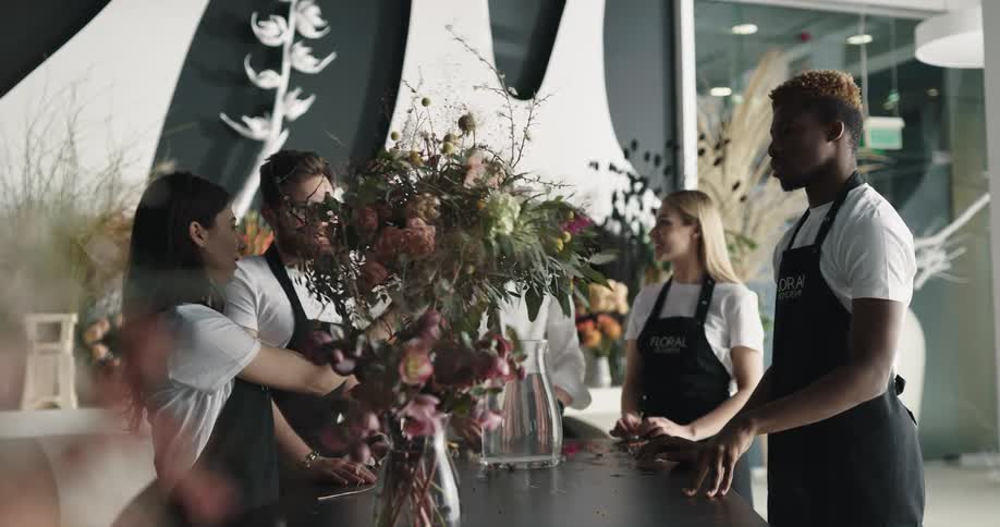 Workers put together a bouquet together