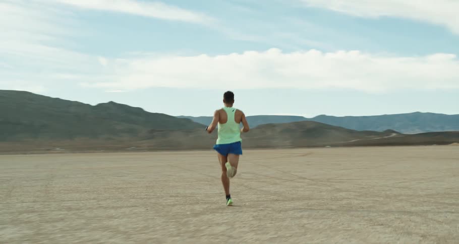 Young man jogging outside the desert