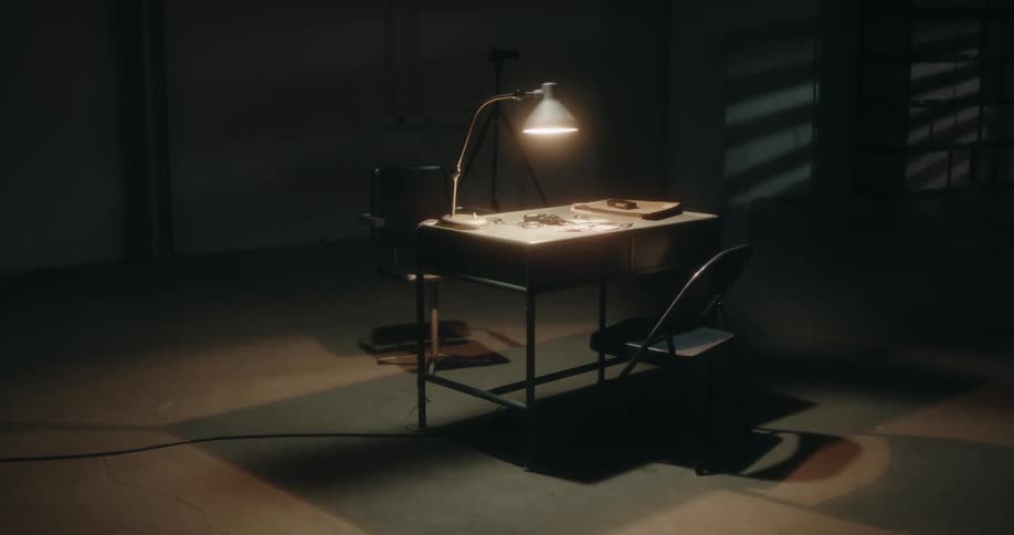 The fan spins above the table