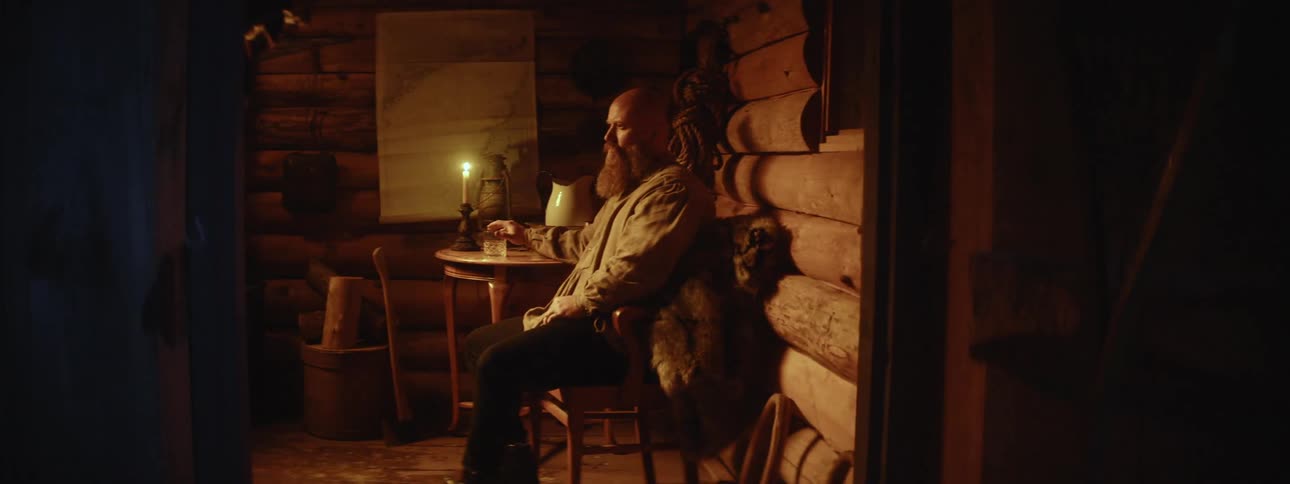 Man is sitting on a chair