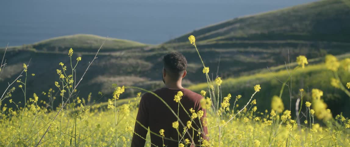 Man is standing outdoors