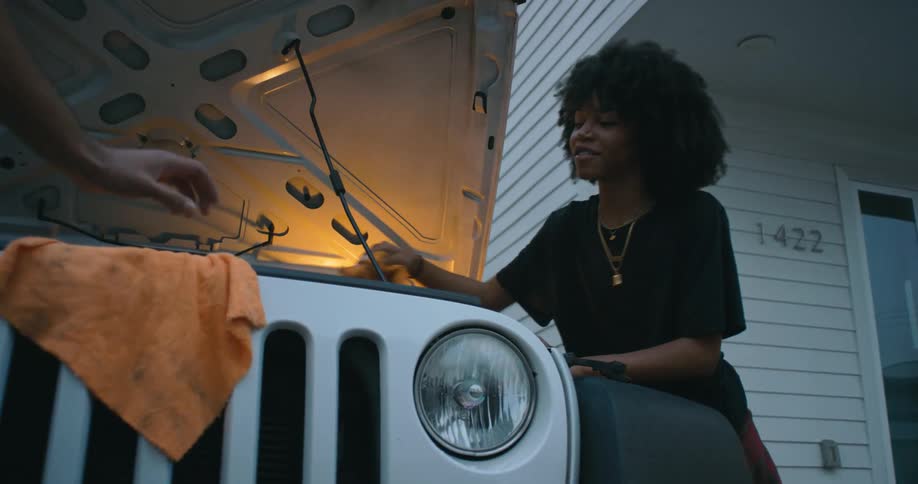 Woman is fixing a vehicle