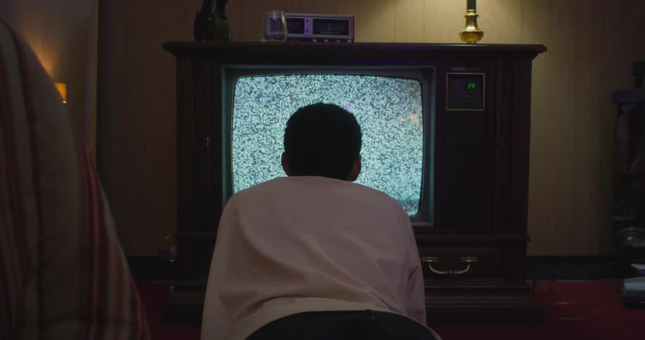 Boy is watching television