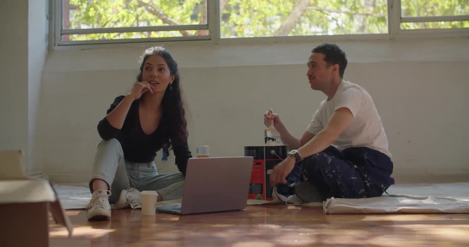 Woman and man are sitting on the floor