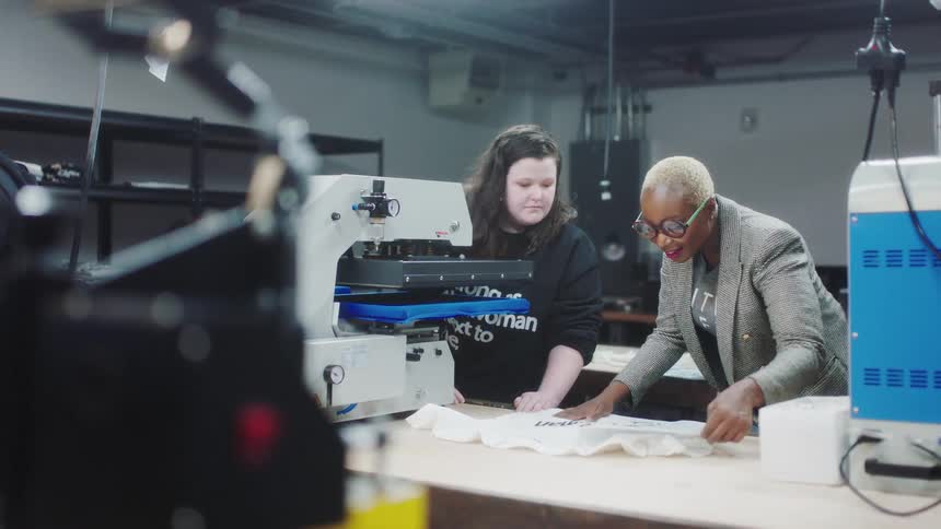 Coworkers are working in the factory with each other