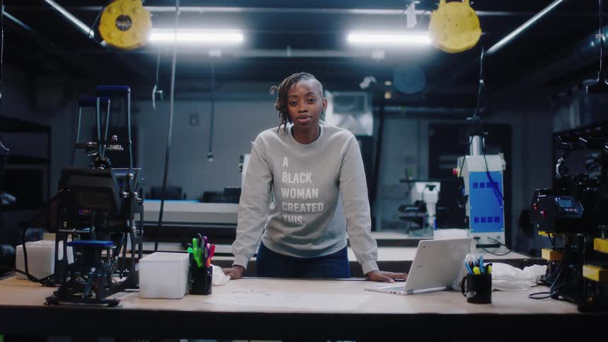 A woman is posing in the workshop