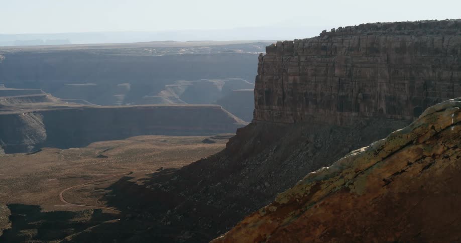 Aerial view of a valley with cliffs is displayed