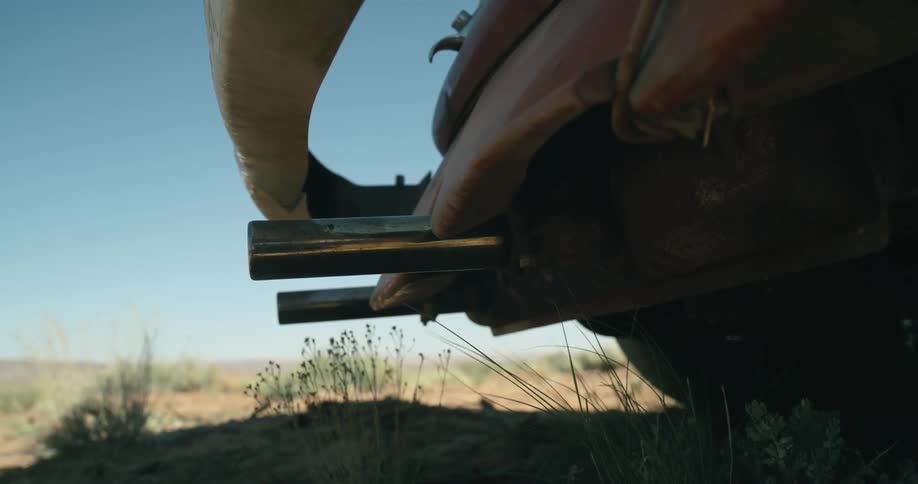 The tailpipe on a car moves as the engine is revved