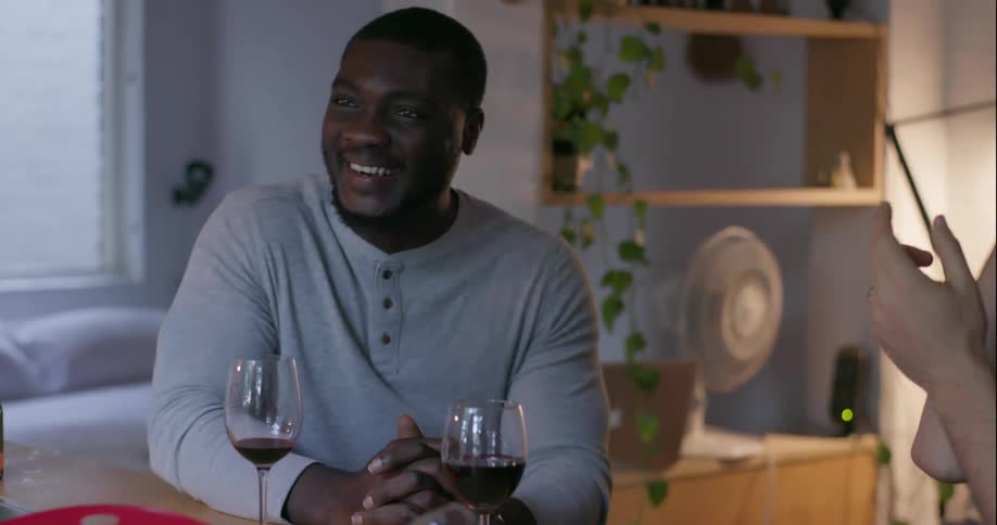 People smile, talk, and laugh while having drinks