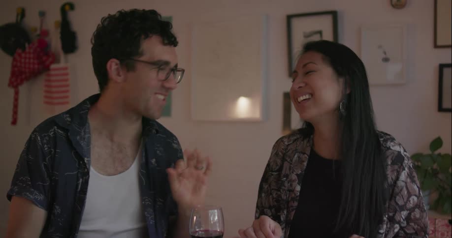 A couple eat dinner and talk