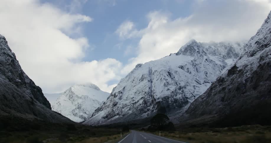 A road through snowy mountains