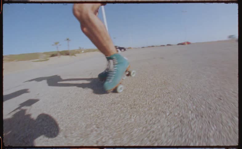 A person is roller skating in the lot