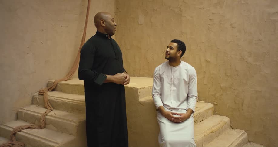 Two men have a conversation