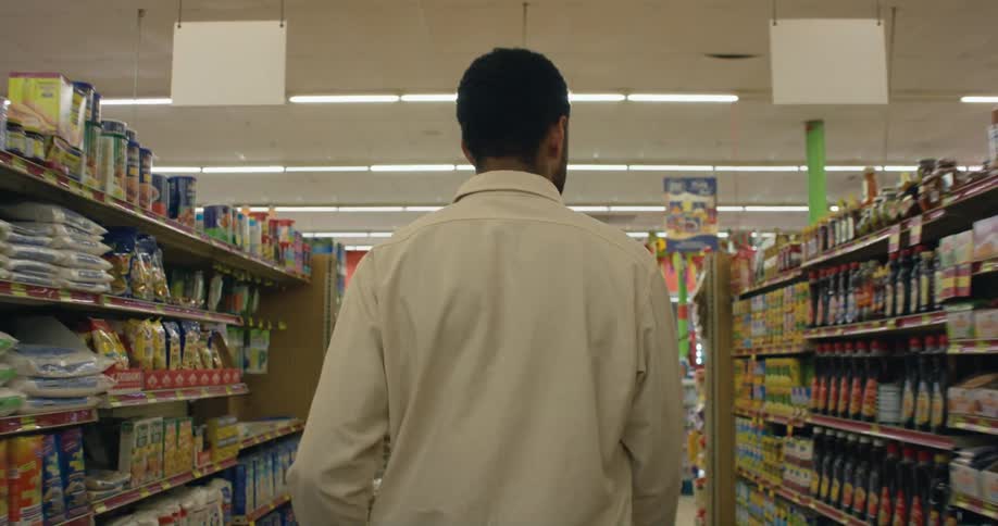 A man walks through the grocery store
