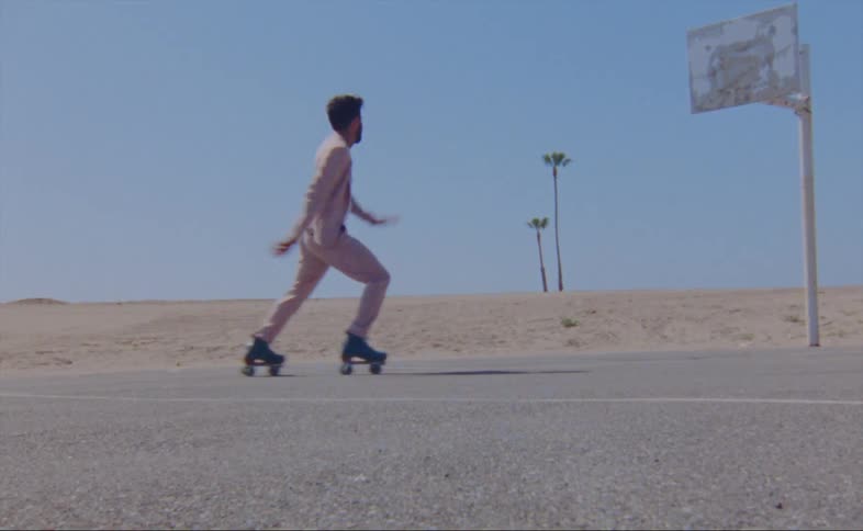 A man dances on roller skates
