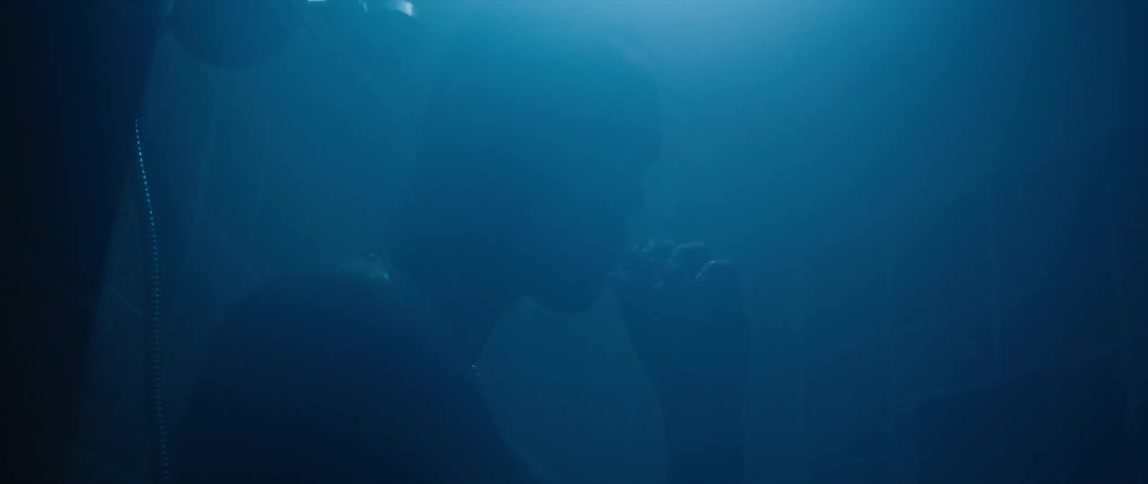 A man sitting underwater