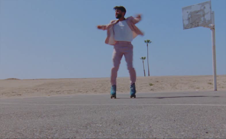 A man is dancing in roller skates
