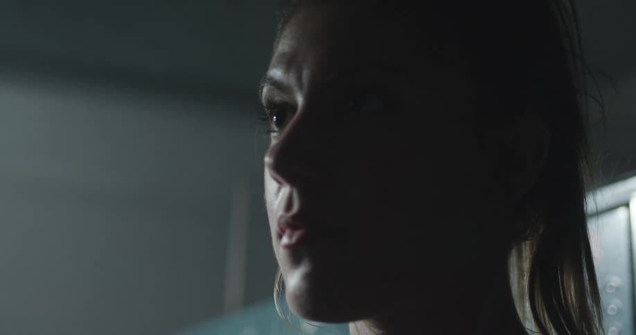 A woman stares at something intently