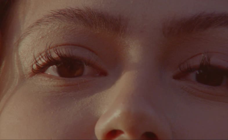 A woman has long eyelashes