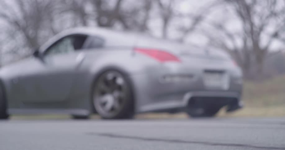 A car speeds off on a road