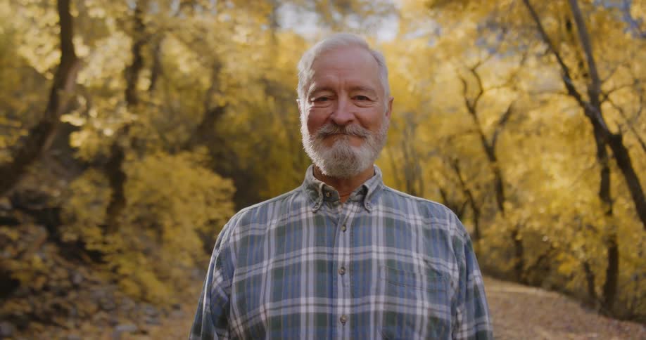 A man is smiling on the trail