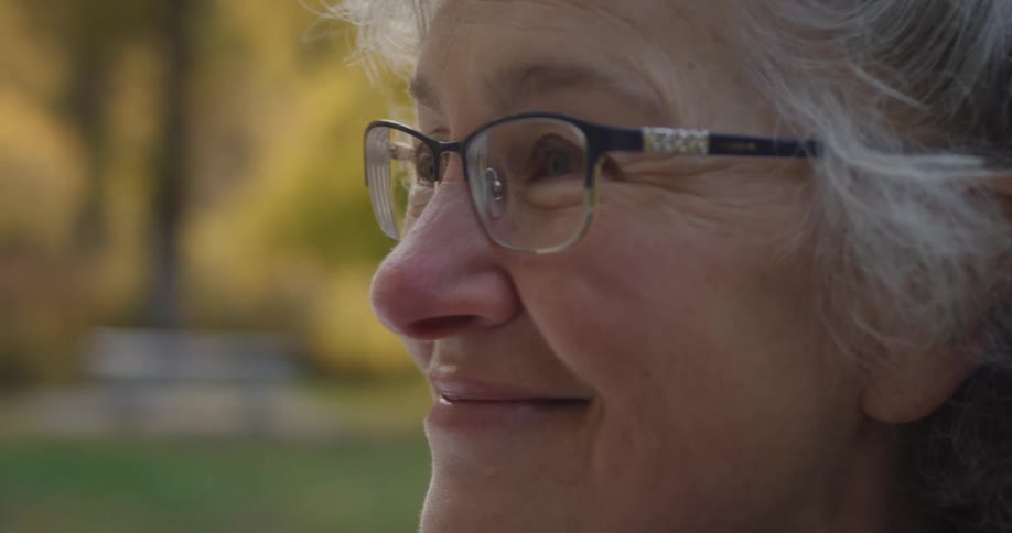 A woman smiles and nods her head