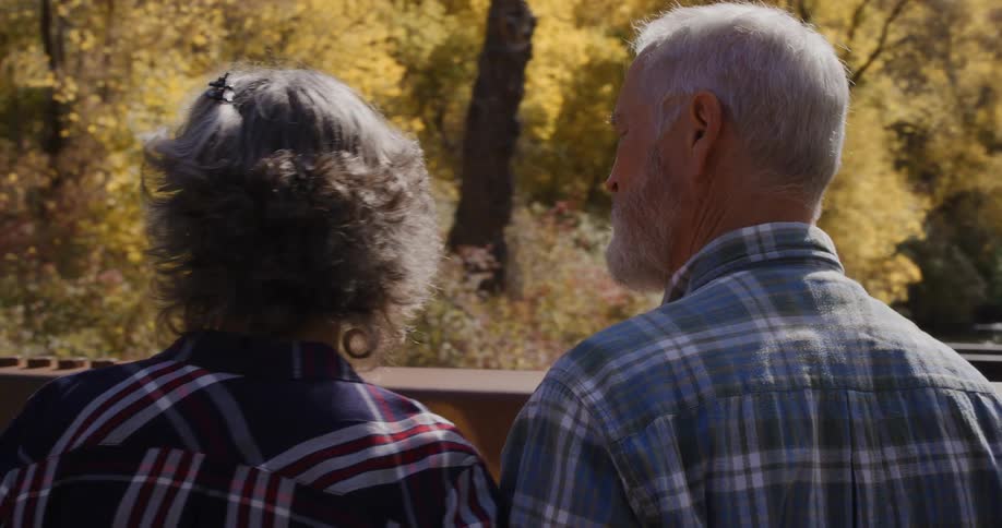 Two people walking outdoors in the fall
