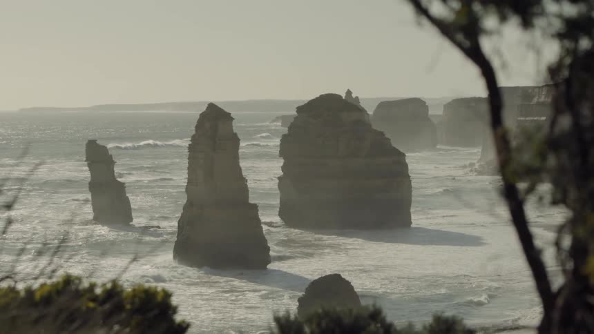 Large rocks line the coast