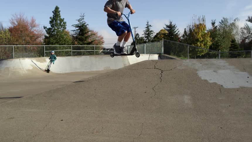 Children Riding Scooters