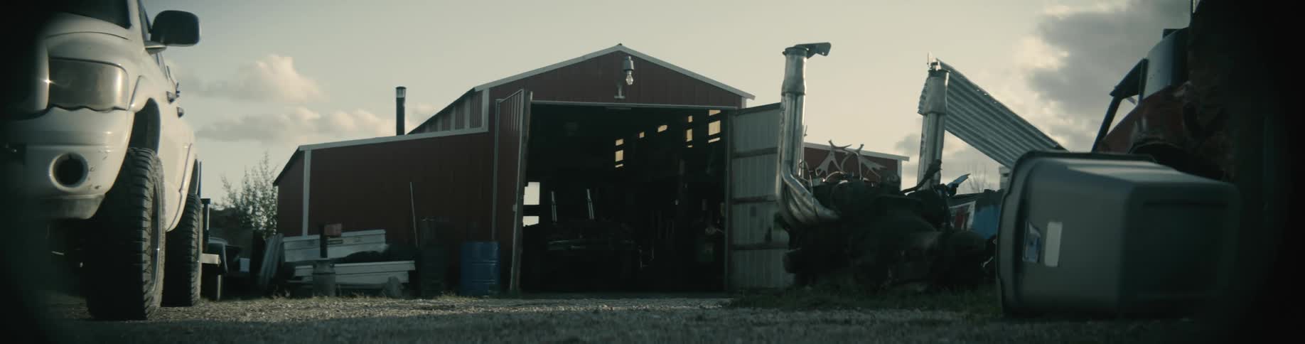 The view is of a car and building that is located outside