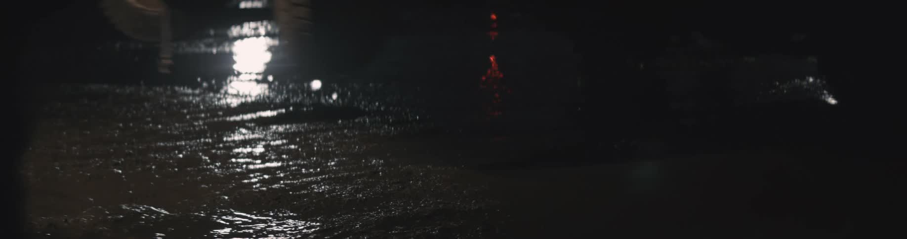 People are walking outdoors while its raining
