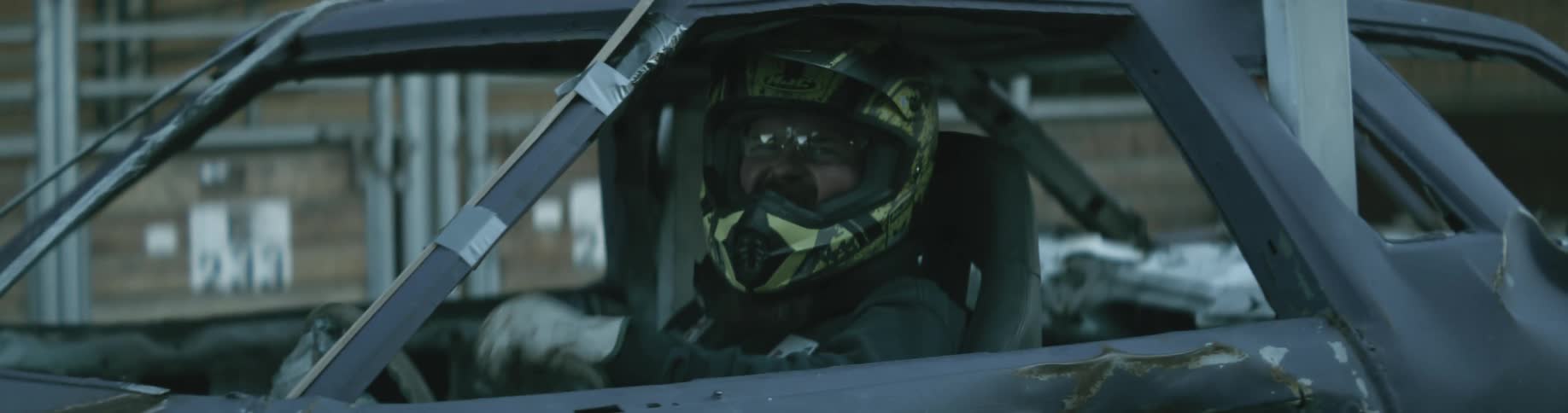 A crash test driver gives a thumbs up