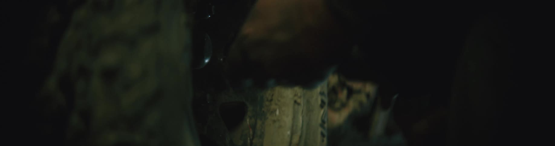 A person is shining the flashlight on the tire of this vehicle