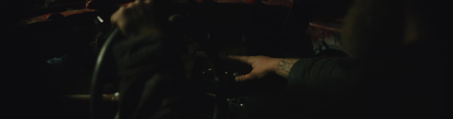 A person presses buttons in the car