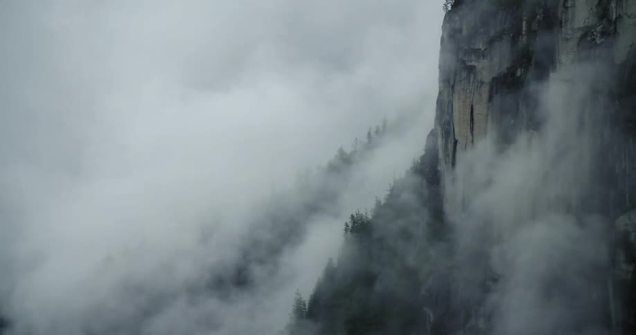 The clouds flow up the mountain