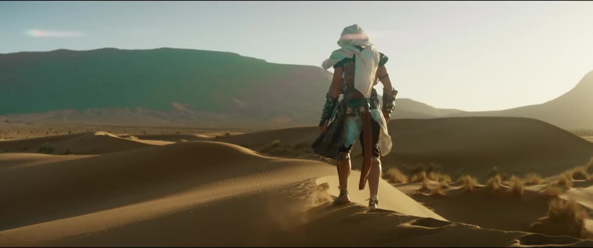 A man is walking in the desert