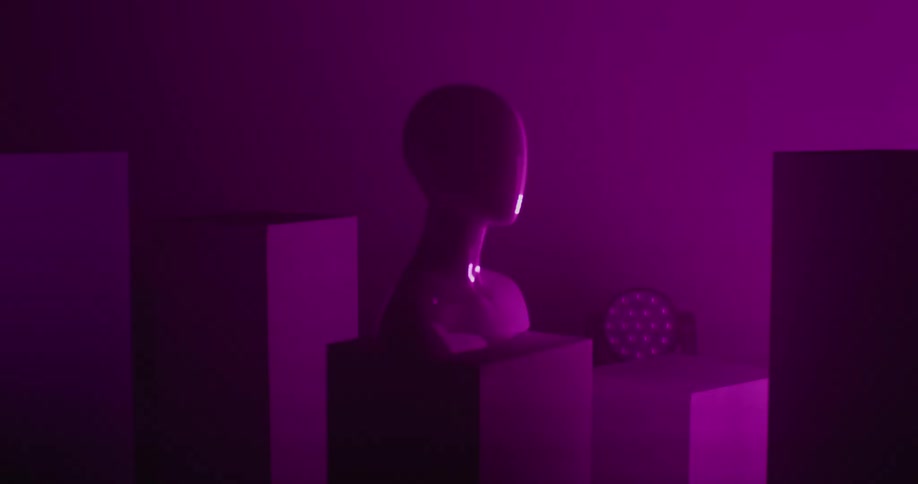 A colorful strobe light reflects off a female mannequin on a display