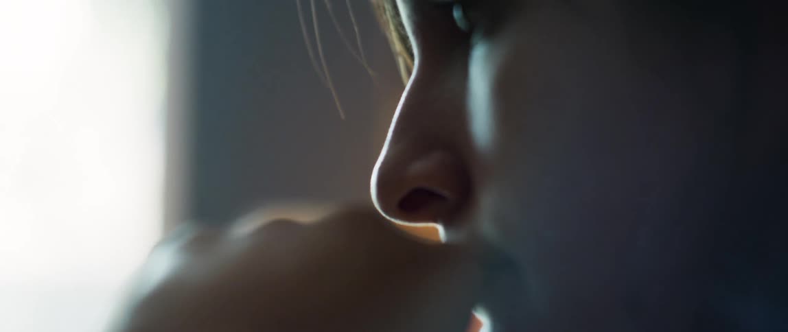 A close up view of a womans face is displayed