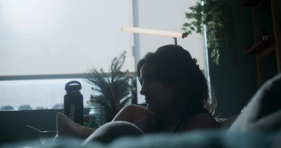 A woman is relaxing on the couch